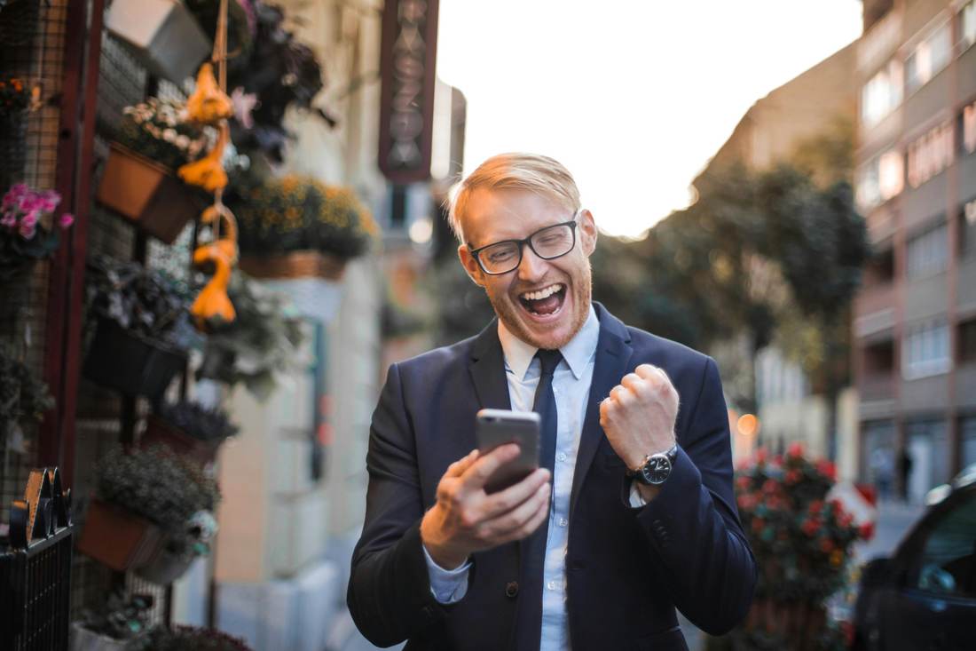 High Impact Habits - motivated agent celebrating success
